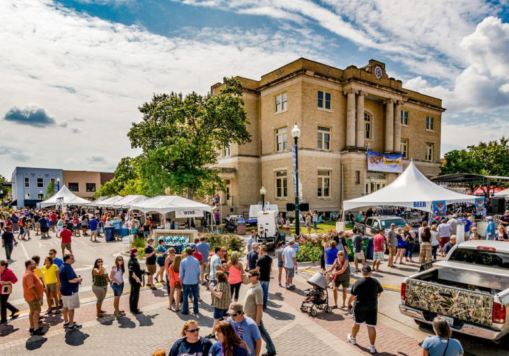 weekend festival with vendors and crowds in historic part of dallas