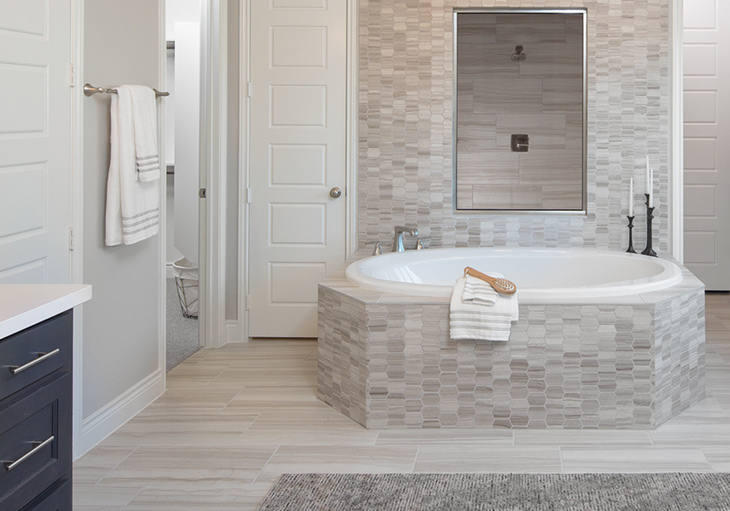 A beautiful bathroom features a geometric tile pattern.